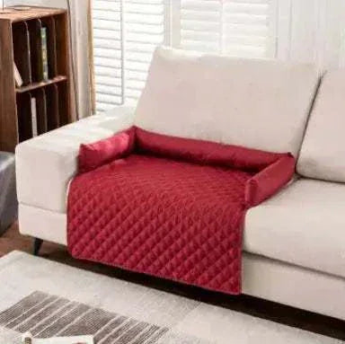 Waterproof pets sofa mat in red with soft ultrasonic cotton on beige couch protecting furniture and providing pet comfort