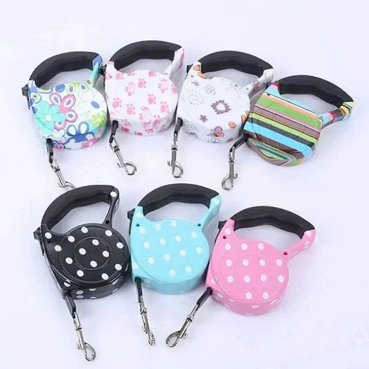 collection of colorful automatic retractable leashes with printed designs for dogs